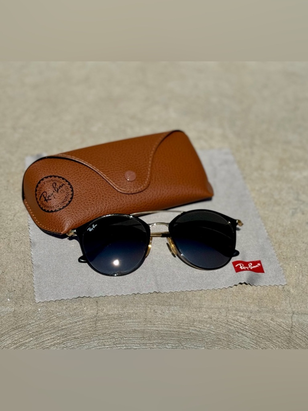 Ray-Ban Women's Black Gradient Round Sunglasses with Gold Accents and Brown Case